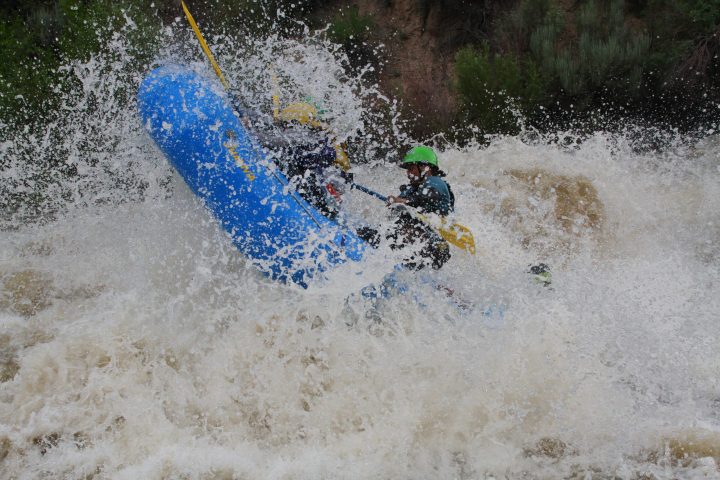 a man riding a wave on a surfboard in the water