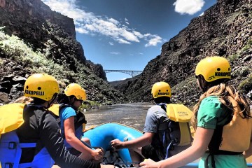 a group of people riding on top of a mountain